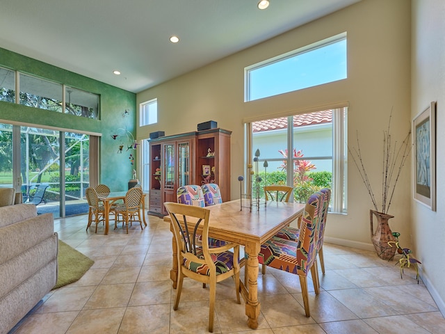 5455 S Fountains Dr S, Lake Worth, FL 33467 - dining area with a high ceiling, plenty of natural light, recessed lighting, light tile patterned floors, and baseboards