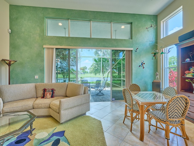 5455 S Fountains Dr S, Lake Worth, FL 33467 - living room with light tile patterned flooring, a high ceiling, and a water view