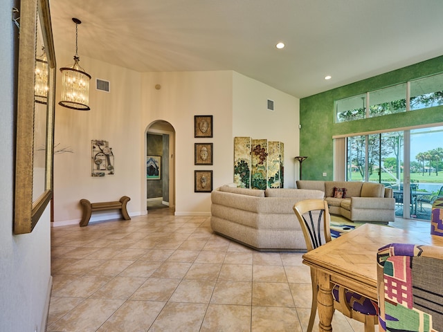 5455 S Fountains Dr S, Lake Worth, FL 33467 - living area featuring arched walkways, a chandelier, light tile patterned floors, recessed lighting, and a towering ceiling