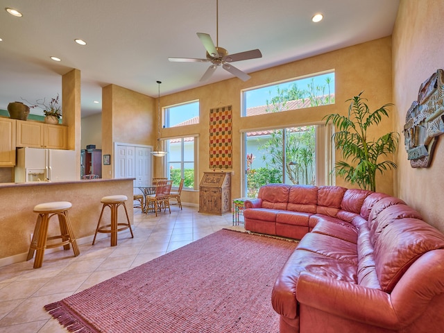 5455 S Fountains Dr S, Lake Worth, FL 33467 - living room featuring a high ceiling, light tile patterned floors, ceiling fan, recessed lighting, and baseboards
