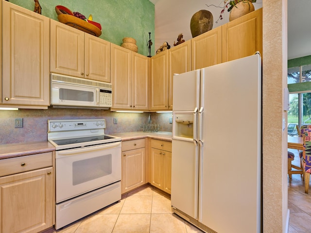 5455 S Fountains Dr S, Lake Worth, FL 33467 - kitchen featuring white appliances, light brown cabinetry, light tile patterned floors, light countertops, and decorative backsplash