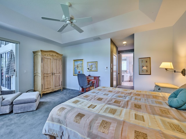 5455 S Fountains Dr S, Lake Worth, FL 33467 - bedroom with dark carpet, a tray ceiling, a ceiling fan, and baseboards
