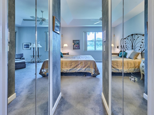 5455 S Fountains Dr S, Lake Worth, FL 33467 - carpeted bedroom with a tray ceiling and baseboards