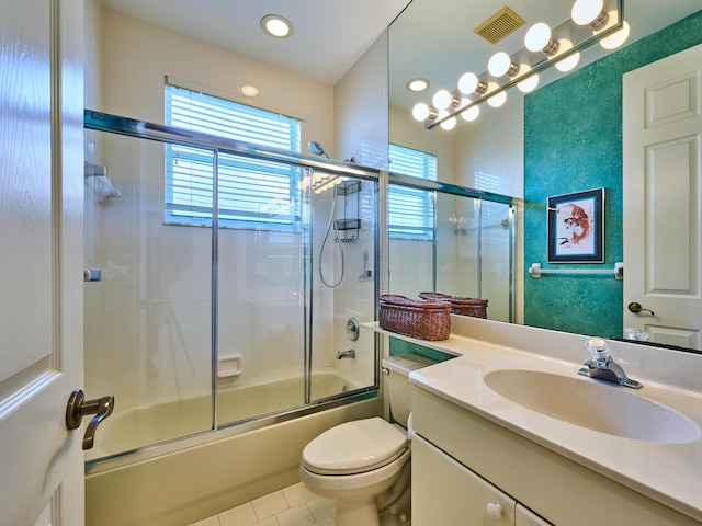5455 S Fountains Dr S, Lake Worth, FL 33467 - full bathroom featuring shower / bath combination with glass door, vanity, toilet, and tile patterned flooring