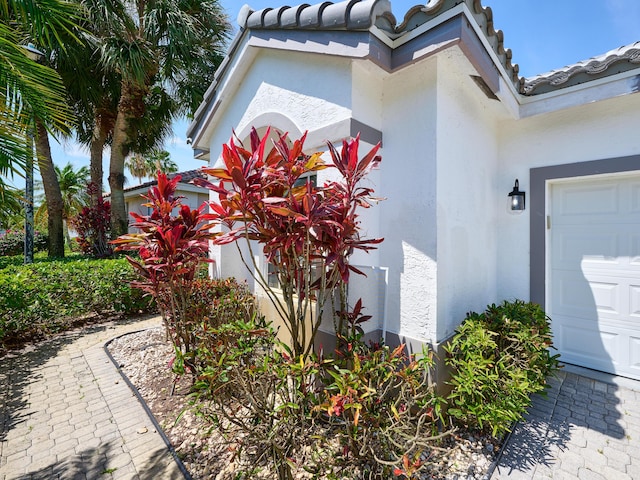 5455 S Fountains Dr S, Lake Worth, FL 33467 - view of property exterior featuring a tile roof and stucco siding