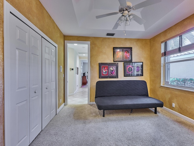 5455 S Fountains Dr S, Lake Worth, FL 33467 - living area with baseboards, carpet, ceiling fan, a tray ceiling, and a textured wall
