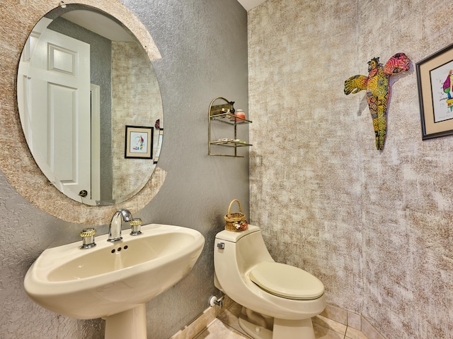 5455 S Fountains Dr S, Lake Worth, FL 33467 - bathroom with a textured wall, toilet, and a sink