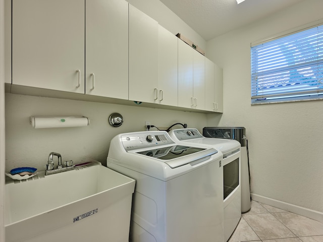 5455 S Fountains Dr S, Lake Worth, FL 33467 - laundry room featuring independent washer and dryer, cabinet space, baseboards, and light tile patterned floors