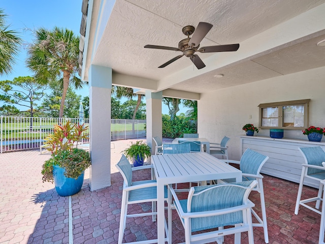 5455 S Fountains Dr S, Lake Worth, FL 33467 - view of patio featuring a ceiling fan, fence, and outdoor dining space