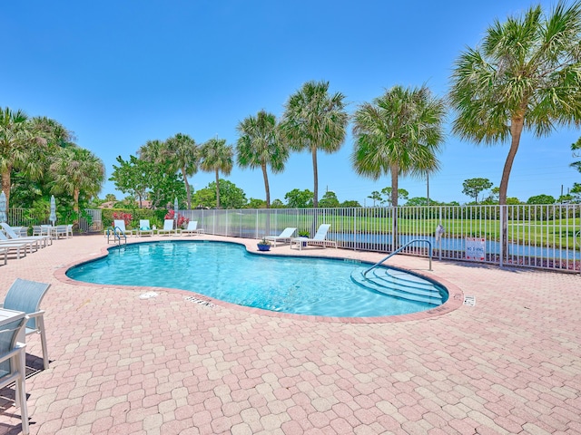 5455 S Fountains Dr S, Lake Worth, FL 33467 - community pool featuring fence and a patio area