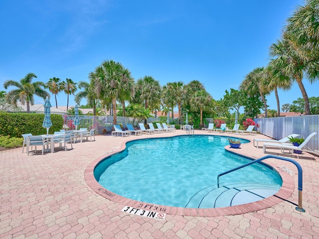 5455 S Fountains Dr S, Lake Worth, FL 33467 - community pool with a patio area and fence