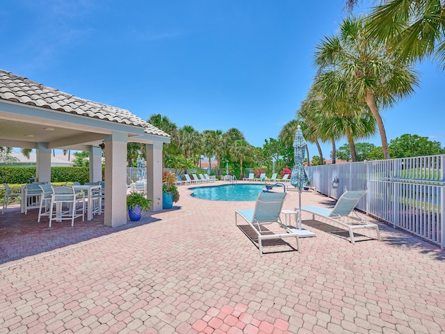 5455 S Fountains Dr S, Lake Worth, FL 33467 - community pool with fence and a patio area