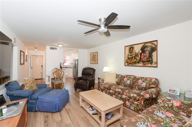 1925 SW Palm City Rd Unit C, Stuart, FL 34994 - living area with light wood-style floors and a ceiling fan