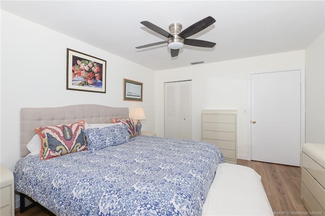 1925 SW Palm City Rd Unit C, Stuart, FL 34994 - bedroom featuring wood finished floors, a closet, and ceiling fan