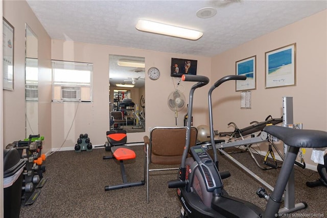 1925 SW Palm City Rd Unit C, Stuart, FL 34994 - exercise room featuring a textured ceiling, baseboards, and cooling unit