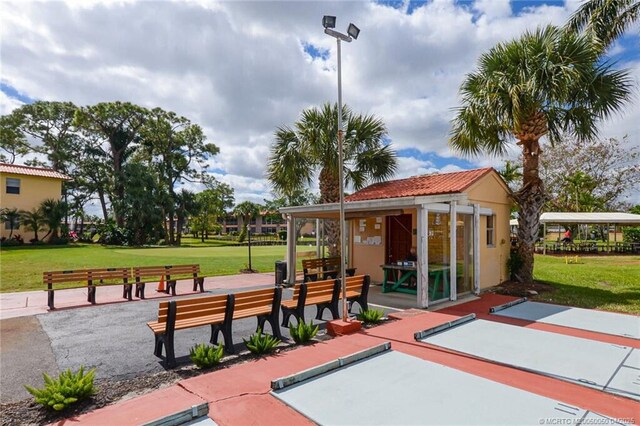 1925 SW Palm City Rd Unit C, Stuart, FL 34994 - view of patio featuring an outbuilding