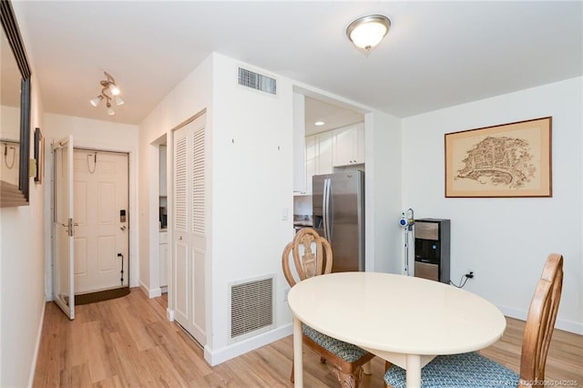 1925 SW Palm City Rd Unit C, Stuart, FL 34994 - dining area with light wood finished floors and baseboards