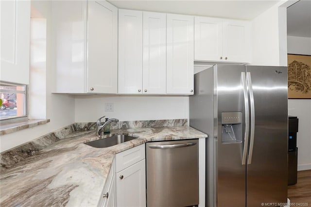 1925 SW Palm City Rd Unit C, Stuart, FL 34994 - kitchen featuring appliances with stainless steel finishes, a sink, and white cabinets