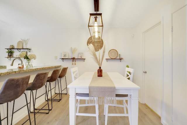 dining room with light wood finished floors