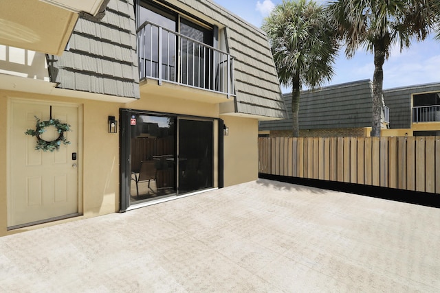 view of patio featuring fence