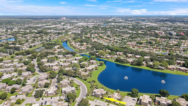 aerial view of residential area featuring a large body of water