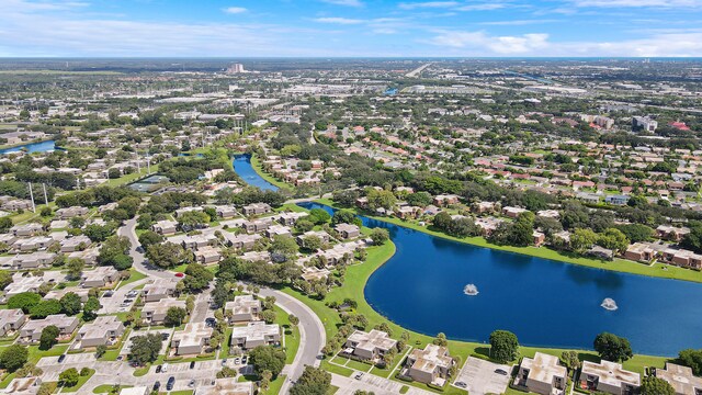 aerial perspective of suburban area with a nearby body of water