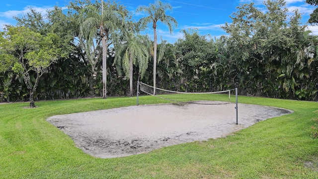 view of home's community featuring volleyball court and a yard