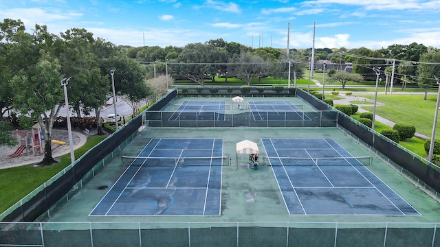 view of tennis court with fence