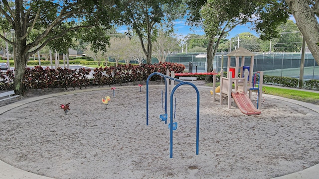 view of community with fence
