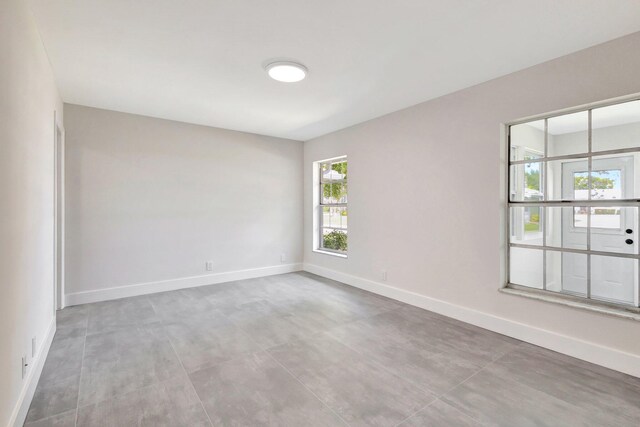 empty room featuring baseboards