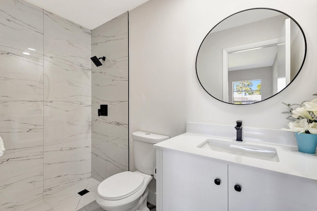 full bathroom featuring a marble finish shower, toilet, and vanity