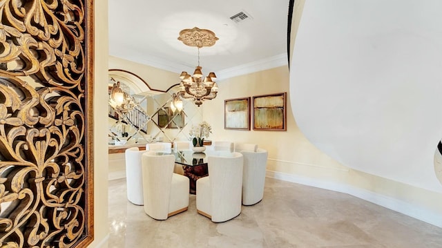 dining room with a chandelier, ornamental molding, and baseboards