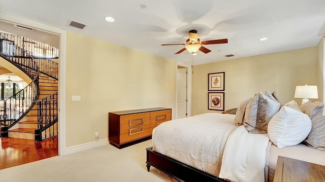 bedroom featuring carpet flooring, recessed lighting, baseboards, arched walkways, and ceiling fan
