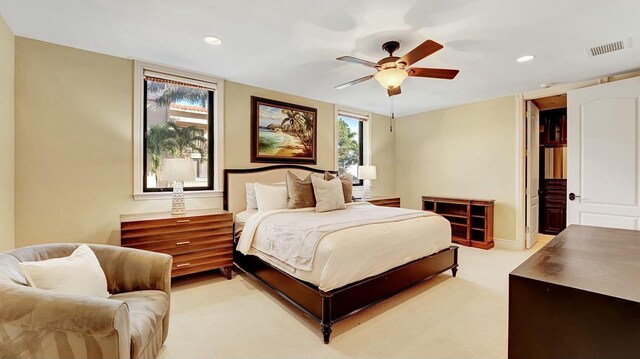 bedroom with recessed lighting, light colored carpet, and ceiling fan