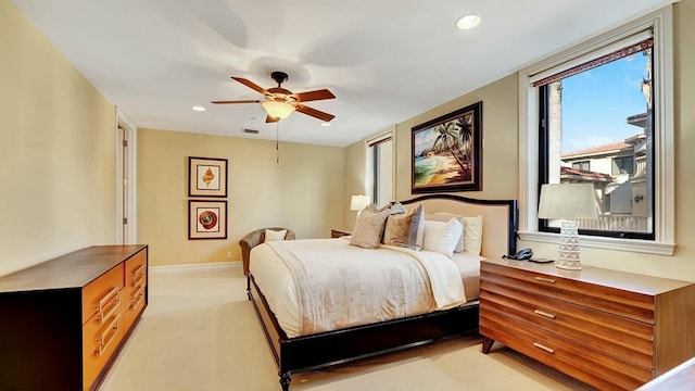 bedroom featuring light colored carpet, baseboards, a ceiling fan, and recessed lighting
