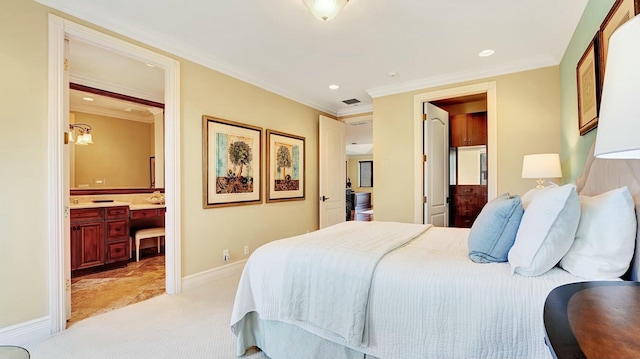 bedroom featuring light carpet, ensuite bathroom, baseboards, crown molding, and recessed lighting