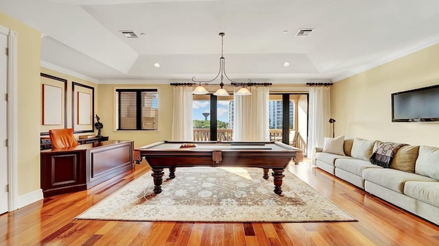 recreation room featuring a tray ceiling, light wood-style flooring, ornamental molding, billiards table, and recessed lighting