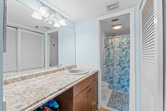 896 N Federal Hwy Unit 121, Lantana, FL 33462 - full bath featuring toilet, a closet, vanity, and tile patterned floors