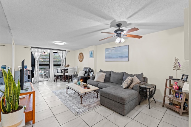 896 N Federal Hwy Unit 121, Lantana, FL 33462 - living area featuring light tile patterned floors, a ceiling fan, and a textured ceiling