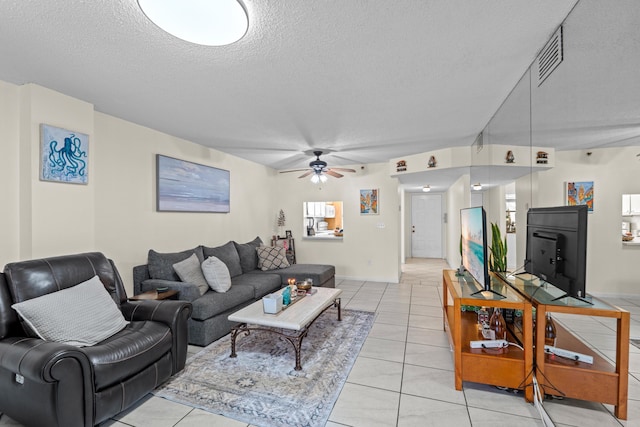 896 N Federal Hwy Unit 121, Lantana, FL 33462 - living area with a textured ceiling, ceiling fan, and light tile patterned floors