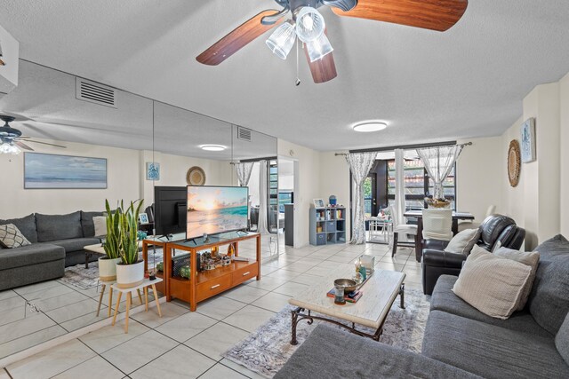 896 N Federal Hwy Unit 121, Lantana, FL 33462 - living area with ceiling fan, a textured ceiling, and light tile patterned flooring
