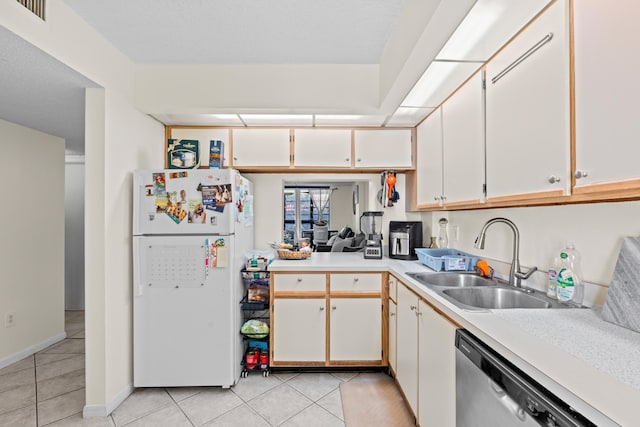 896 N Federal Hwy Unit 121, Lantana, FL 33462 - kitchen featuring freestanding refrigerator, a sink, stainless steel dishwasher, light countertops, and light tile patterned flooring