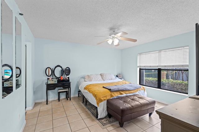 896 N Federal Hwy Unit 121, Lantana, FL 33462 - bedroom with light tile patterned floors, a ceiling fan, and a textured ceiling