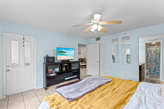 896 N Federal Hwy Unit 121, Lantana, FL 33462 - bedroom with tile patterned flooring, a textured ceiling, and ceiling fan