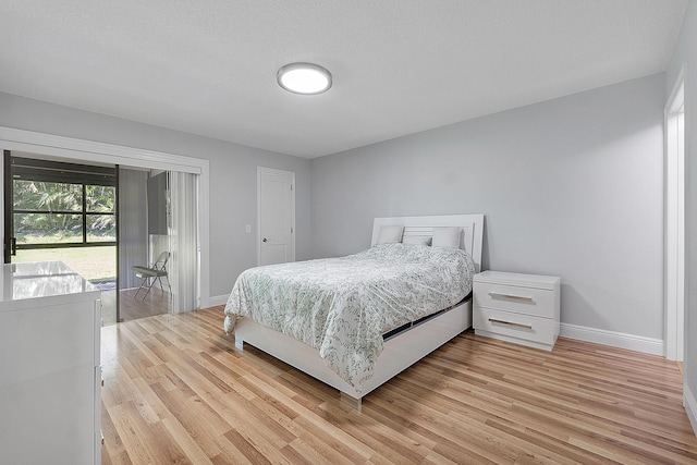 3839 Coco Loba Ln, Boynton Beach, FL 33436 - bedroom featuring baseboards, light wood-style flooring, and access to exterior