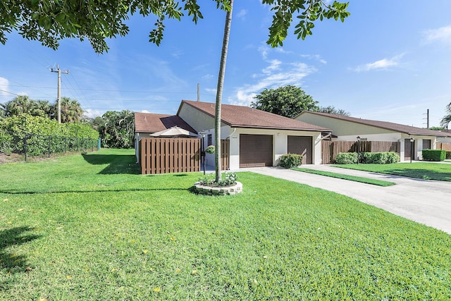3839 Coco Loba Ln, Boynton Beach, FL 33436 - ranch-style house featuring driveway, an attached garage, and stucco siding
