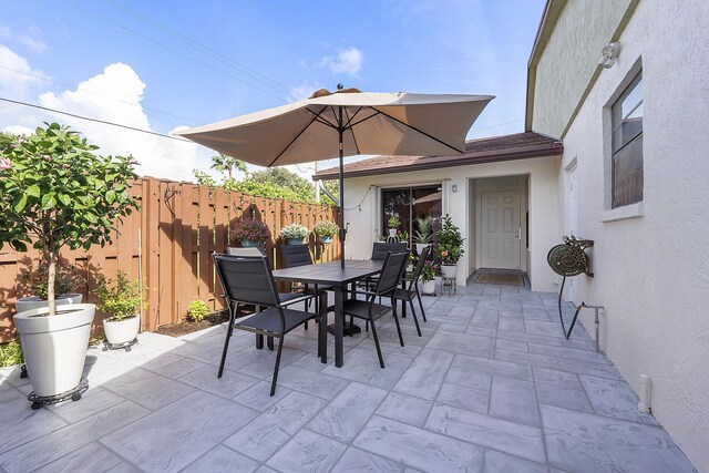 3839 Coco Loba Ln, Boynton Beach, FL 33436 - view of patio with fence and outdoor dining area