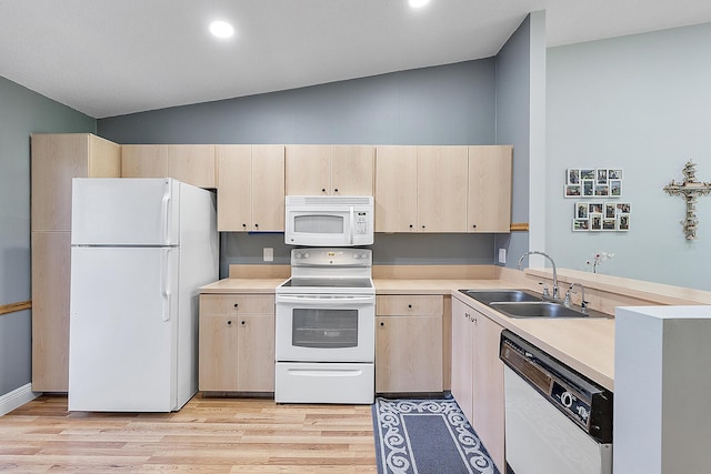 3839 Coco Loba Ln, Boynton Beach, FL 33436 - kitchen with white appliances, a sink, light brown cabinets, light wood-style flooring, and high vaulted ceiling