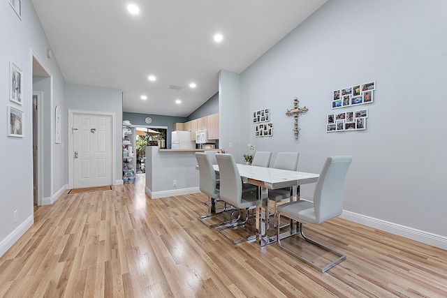 3839 Coco Loba Ln, Boynton Beach, FL 33436 - dining room with light wood-style flooring, vaulted ceiling, baseboards, and recessed lighting