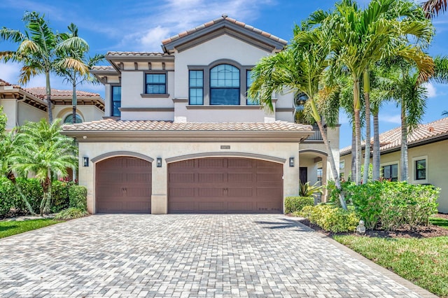 8979 Little Falls Way, Delray Beach, FL 33446 - mediterranean / spanish house with a tiled roof, stucco siding, driveway, and an attached garage